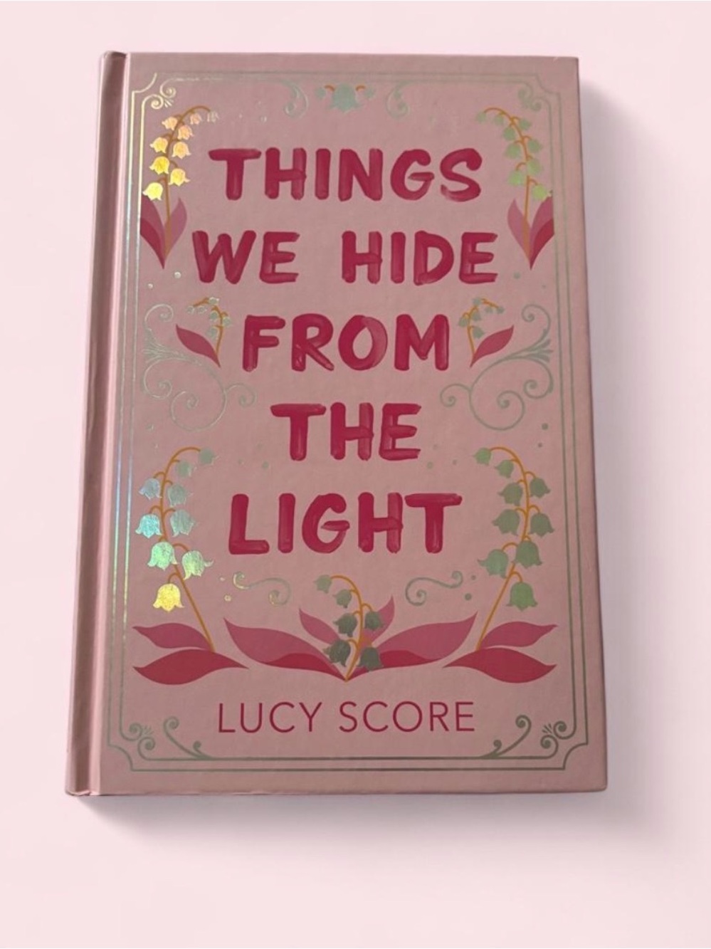Pink Decorative Hardcover Book "Things We Hide From The Light"